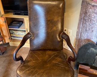 There are a pair of these antique leather arm chairs 