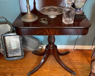 Antique mahogany swivel top game table with carved spiral pedestal base