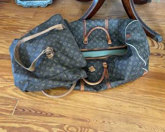 I have two well-used LV bags.  Not certain if one is authentic but the large duffle is authentic.  These can be sent off to be restored.  Priced accordingly 