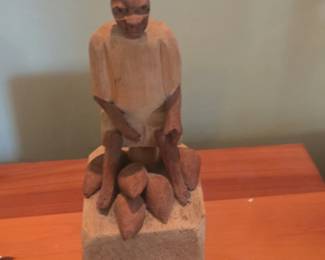 HandCarved Wooden Figurine of a Seated Farmer