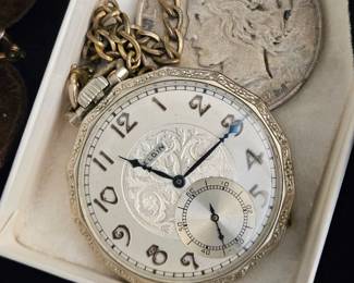 Pocket watch with silver coin watch fob