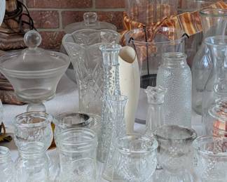 Vintage clear glass vases and jars.