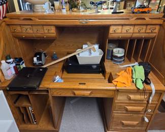 Roll top desk, model airplanes, desk lamp