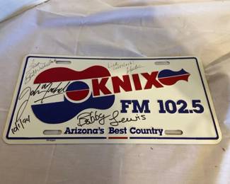 Four KNIX FM License Plates