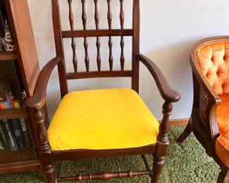 Ethan Allen Baumritter Georgian Court spindle back dining arm chair featuring a solid cherry wood frame and a bright yellow cushion