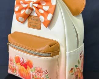 Loungefly Disney Minnie Mouse Pumpkin Ombre Mini Backpack features a white-to-orange gradient design