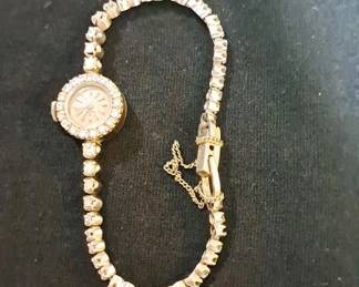 Vintage 1954 Ladies Rolex Watch with Mother of Pearl Clock Face surrounded by 18 Diamonds, a 1400 Watch Movement and a 14K Tennis Bracelet Watch Band Encrusted with 44 Diamonds Total Carat Weight of Diamonds is 5.3k (it is missing one .10 diamond on the watch band) Serial number of the Rolex is 63686. We will be taking offers on the Gold Coin and the Rolex Watch until 12 Noon on Saturday. Offers start at $4,000 on the Rolex watch with a minimum increment of $250. Please contact by phone or text Billie Axley at 931-996-3929 to register for Bidding. Winning bidder will be notified at Noon on Saturday. Terms of Sale for these items is Cash Only.
