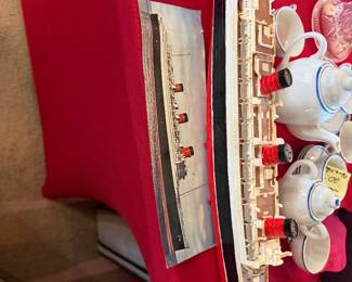 Model of Queen Mary ship with postcard