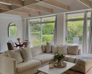 in the cottage: sleeper sectional, marble top coffee table