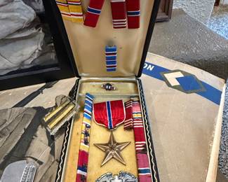 World War II–era U.S. Army medal grouping, likely belonging to an infantry soldier, and it represents a fairly decorated service record. From the photo I can identify several pieces:  1. Bronze Star Medal (center star)  The bronze five-point star medal is the Bronze Star Medal, established in 1944 during WWII.  💲💲PRICED at $125.00
