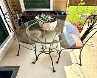 $250 Wrought iron bistro table with glass top, 2 chairs 