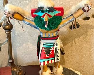 $130 - This item is a handcrafted Native American Kachina doll representing the Eagle Dancer, typically featuring wood carving, painted details, and feathers.It is often signed by the artist, with similar vintage models measuring between 5 to 14 inches tall.The doll symbolizes the sacred eagle, used in dances to pray for rain and plentiful crops
