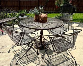 $400 Vintage wrought iron table + 4 chairs 