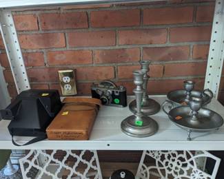 Vintage cameras and candlesticks