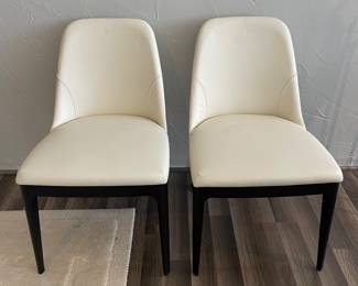 $585 Pair.  Alma Chair with Black Ash Legs and Cream Leather - 2 Available. Sold as a Pair.  23” x 20.5” x 30”