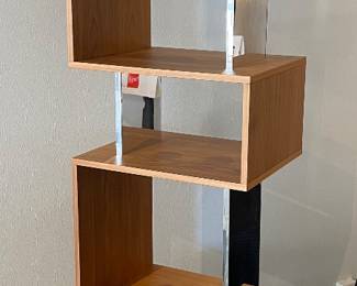 $995 Osuna Swivel Bookcase in Walnut. 18.1” x 14.2” x76.8”