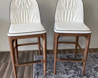 $995 Pair Mivida Stool with Walnut Legs and White Eco Leather  with Black Piping - 2 Available. Sold as a Pair. 28”