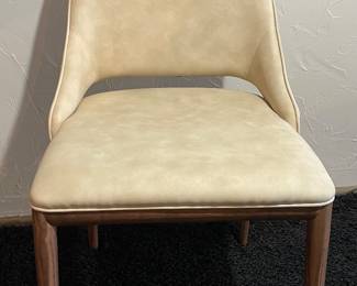 $850 per Pair Malva Chair. Walnut Legs and Eco leather  Nabuk Beige - 4 Available, sold per pair 18.5” x 22” x 32.7”