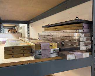 Many rectangular brass canopies with steel fireplates.