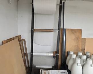 Large tall packing material rack for rolls of foam or bubble wrap.