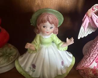 Vintage Porcelain Figurine of a Young Girl in Green Dress