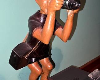 Wood carved photographer