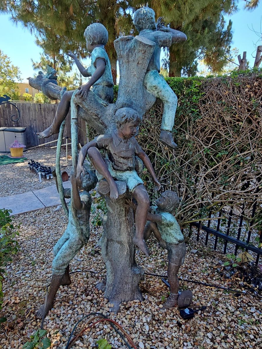 Bronze Sculpture of Four Children Playing in a Tree
