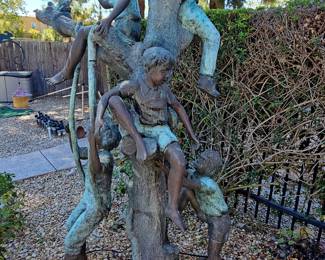 Bronze Sculpture of Four Children Playing in a Tree