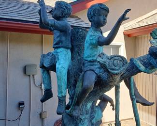 Bronze Sculpture of Four Children Playing in a Tree