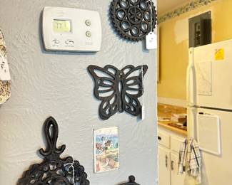 Iron trivets and lots of kitchenware