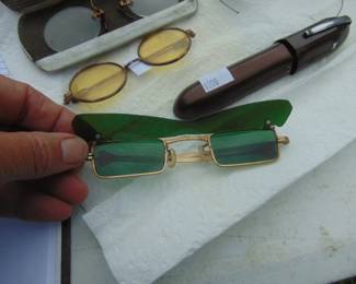 Unique antique glasses. Yellow ones are $80. Green Lennon glasses are $200 and come with case