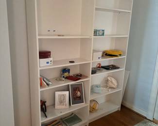 2 white shelving units