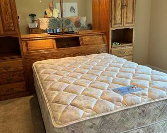 This Fabulous Integrative wall unit is one of the most amazing pieces I have seen in awhile! The "Night Stands pull out from the top cabinet, there are reading lights built into the top, tons of storage space all in solid oak and like new! Mattress is Serta Perfect sleeper still with the tags on it! lights