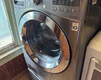LG Stainless Washer with storage drawer beneath