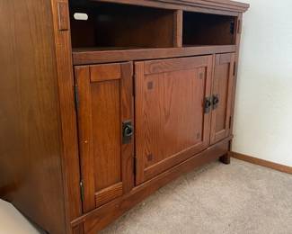 MissionStyle Entertainment Center Featuring A Rich Oak Wood Grain