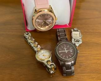 Two Fossil Watches with Pink Macys Watch and Welsbro Watch Face
