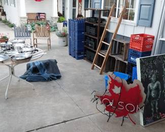 Molson neon sign, stainless pans, wooden crates, milk crates, garden benches