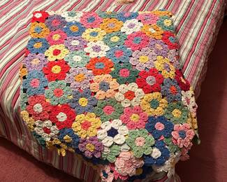 Cloth quilt in granny square pattern. 