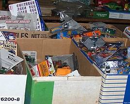 Boxes of new in package Ertl, Hot Wheels, Matchbox, etc.. vehicles