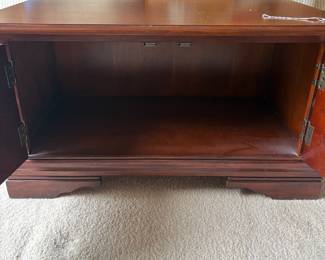 R4 - $50. Drop Leaf Coffee Table. Measures 35" wide x 24" deep x 18" tall. Very good condition! The front is doors (not drawers) the back pulls out for magazine storage.