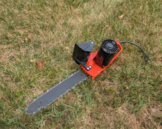 R97 - $40. Remington 14" 2HP Electric Chainsaw.