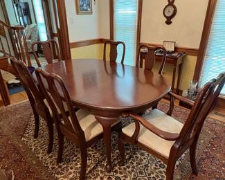 R60 - $600. Knob Creek Dining Table with 2 leaves, 6 chairs & table pad protectors. Excellent condition! Table without leaves is 66" long x 44" wide x 29" tall. 2 - 18" leaves. 2 Captains Chairs. 4 Regular Chairs. All sturdy and solid.