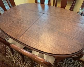 R60 - $600. Knob Creek Dining Table with 2 leaves, 6 chairs & table pad protectors. Excellent condition! Table without leaves is 66" long x 44" wide x 29" tall. 2 - 18" leaves. 2 Captains Chairs. 4 Regular Chairs. All sturdy and solid.