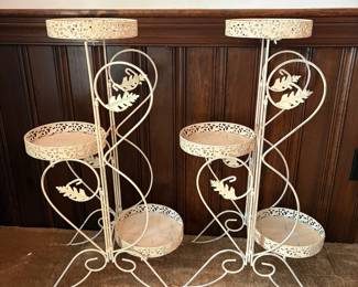 R61 - $30. Pair of 3 Tier Metal Plant Stands. Measures 33" tall.