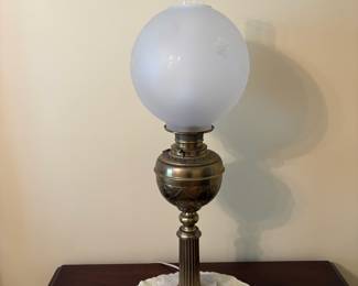 R25 - $175. Electrified Victorian Brass Banquet Lamp with Marble Base. Frosted Glass Shade. Measures 29.5" tall.