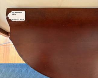 R50 - $40. Demilune Side Table. Measures 23" wide x 11.5" deep x 24.25" tall.