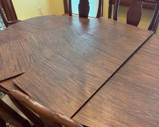 R60 - $600. Knob Creek Dining Table with 2 leaves, 6 chairs & table pad protectors. Excellent condition! Table without leaves is 66" long x 44" wide x 29" tall. 2 - 18" leaves. 2 Captains Chairs. 4 Regular Chairs. All sturdy and solid.