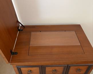 R2 - $30. Empty Wooden Sewing Machine Cabinet. Measures 25" x 18" x 31" tall. Very good vintage condition.