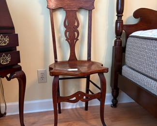 R27 - $150. 1890 Oak Antique Side Chair. Measures 17.5" wide x 19" deep x 42" tall.
