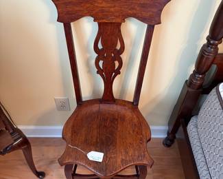 R27 - $150. 1890 Oak Antique Side Chair. Measures 17.5" wide x 19" deep x 42" tall.